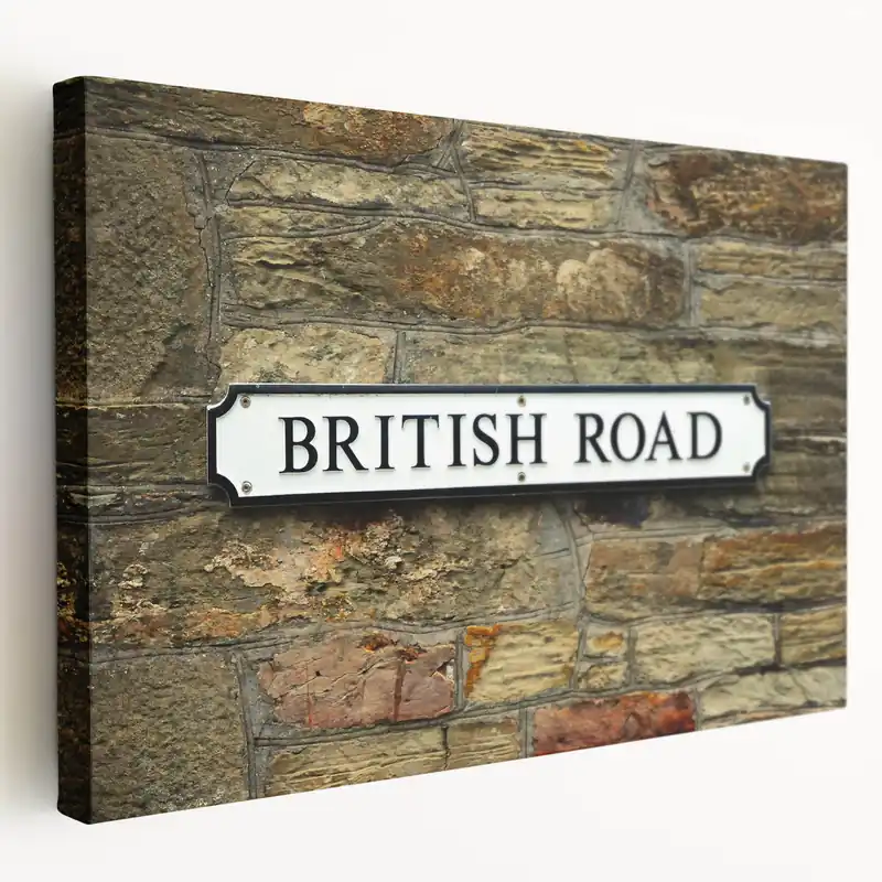 Masonry Wall Art - British Road Sign on Stone Wall Canvas Print Save Now